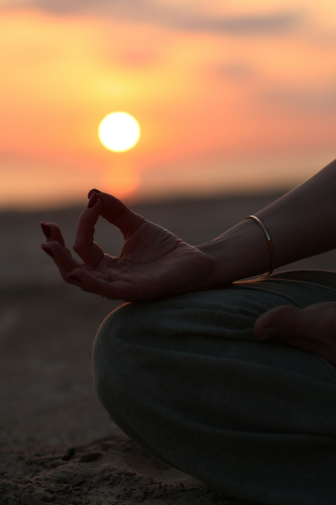 person meditating in morning light