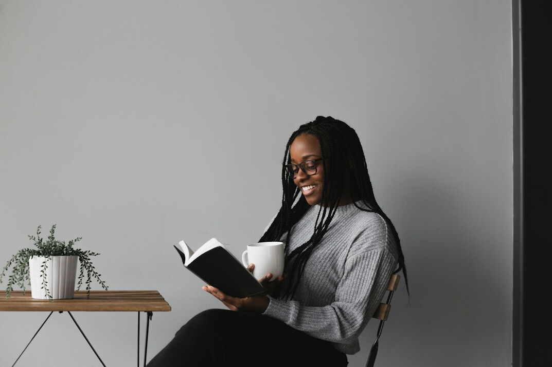 person reading self help book