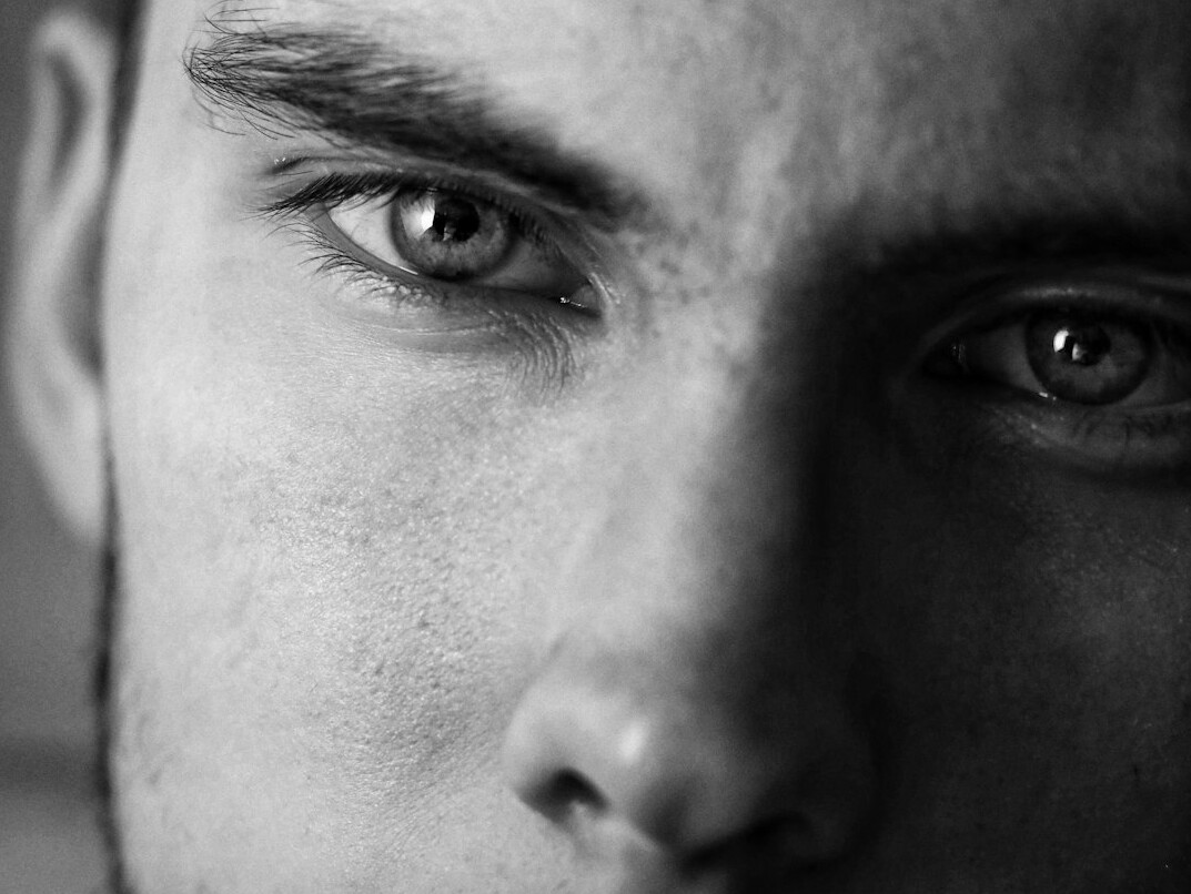 Portrait of a man with light stubble looking at the camera