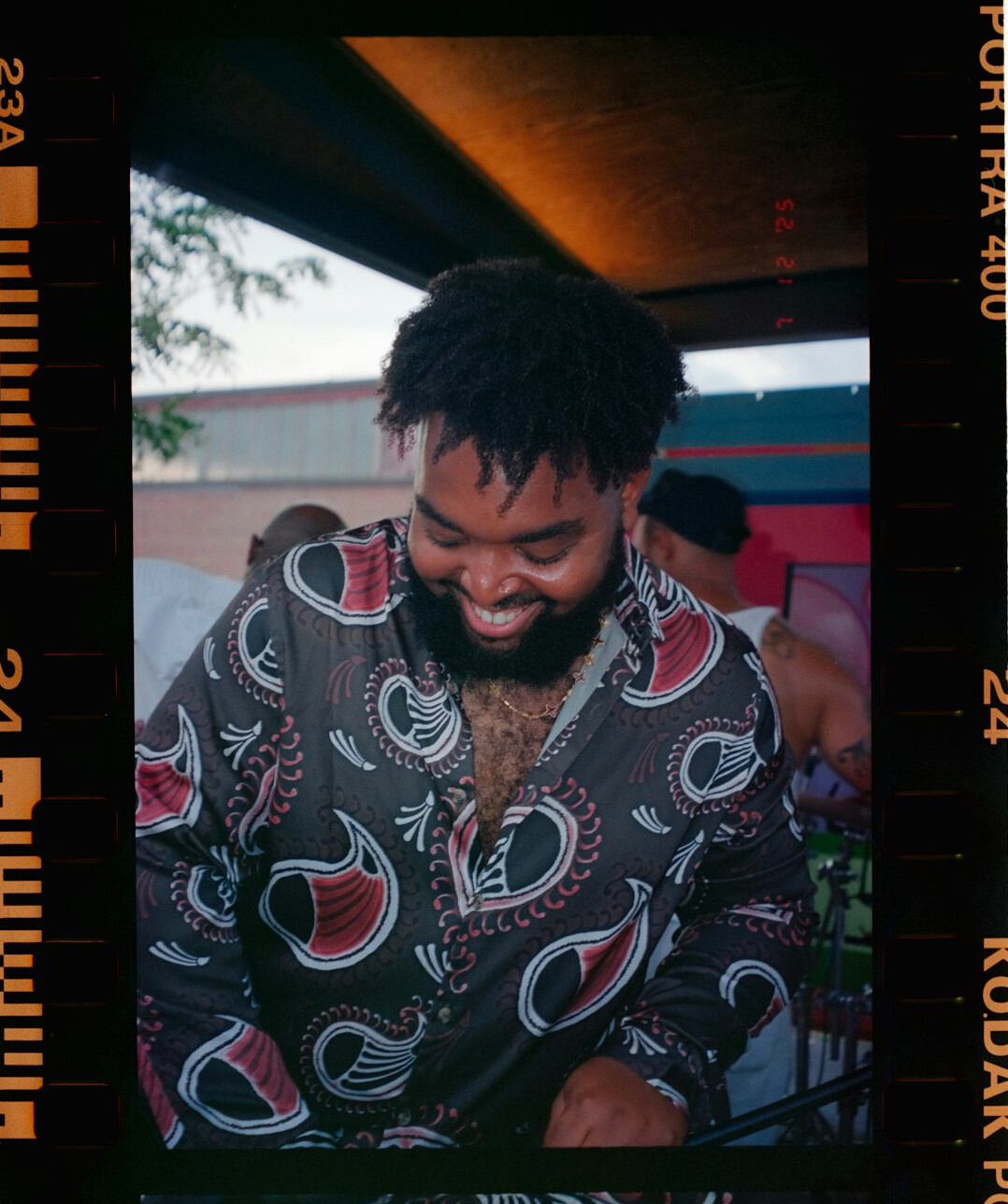 Portrait of a bearded man smiling in a shirt